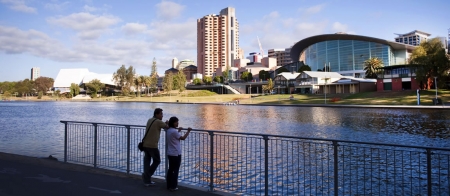 a person standing on a bridge over a body of water