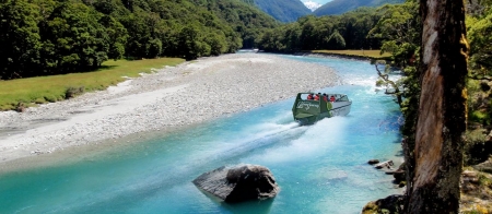 a body of water with a mountain in the background