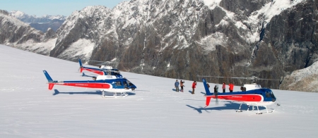 a group of people skiing down a mountain