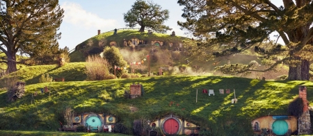 a train that is on top of a lush green field