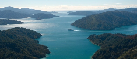 a body of water with a mountain in the background
