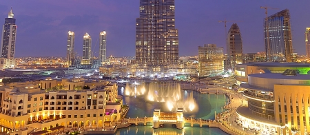 a large body of water with a city in the background