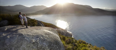 a man standing on a rocky hill