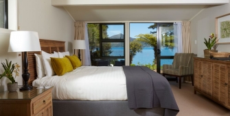 a bedroom with a large bed in a hotel room