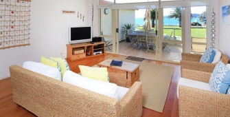 a living room filled with furniture and a bed