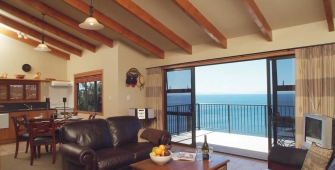 a living room filled with furniture and a large window