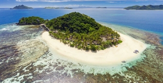 a view of a beach next to a body of water