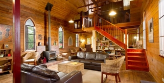 a living room filled with furniture and a fireplace