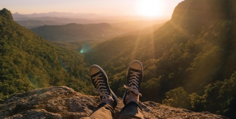 a man standing on top of a mountain