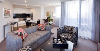 a living room filled with furniture and a flat screen tv