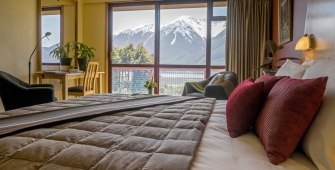 a bedroom with a large bed in a hotel room