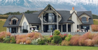 a house with a mountain in the background