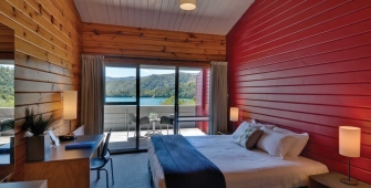 a bedroom with a large bed in a hotel room