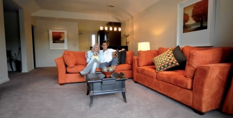 a large red chair in the living room