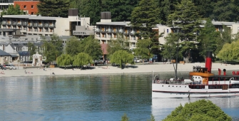 a body of water with a city in the background