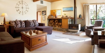 a living room filled with furniture and a fire place