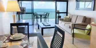 a dining room table in front of a window