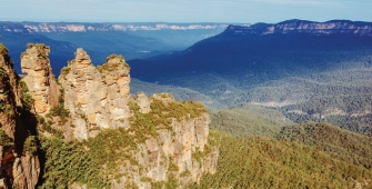 a canyon with a mountain in the background