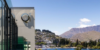 a clock on the side of a mountain