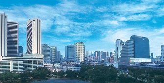 a large body of water with a city in the background