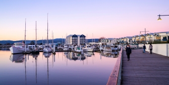 a boat is docked next to a body of water