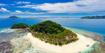 a view of a beach next to a body of water