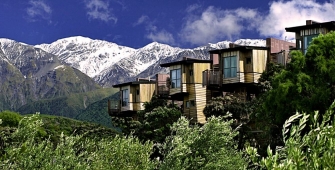 a house with a mountain in the background