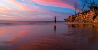 a sunset over a body of water