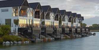 a small house surrounded by water