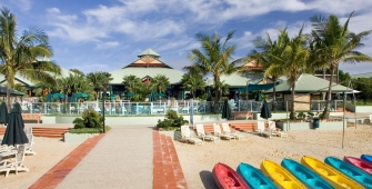 a group of lawn chairs sitting on top of a beach