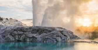 a large waterfall over a body of water