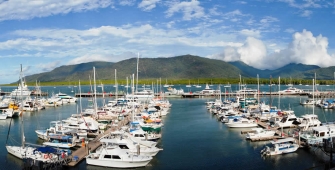 a harbor filled with lots of small boats in a body of water