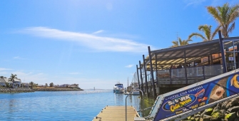 a bus parked in front of a body of water