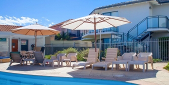 a table topped with a blue umbrella