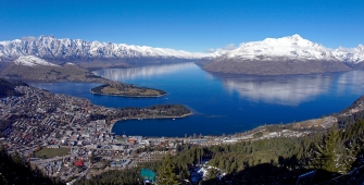 a body of water with a mountain in the background