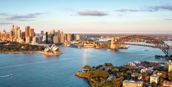 a body of water with a city in the background