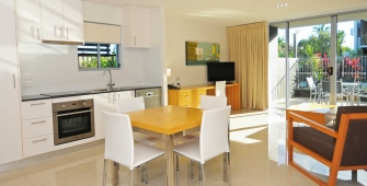 a kitchen with a dining room table