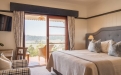 a bedroom with a large bed in a hotel room