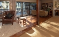 a living room filled with furniture and a large window