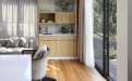 a living room filled with furniture and a large window