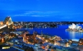 a large body of water with a city in the background