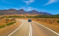 a highway with a mountain in the background