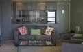 a living room filled with furniture and a fire place