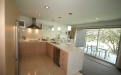 a large kitchen with stainless steel appliances