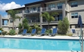 a blue pool of water in front of a building