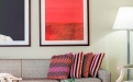 a large red chair in the living room