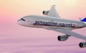 a large passenger jet flying through a cloudy blue sky