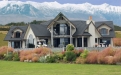 a house with a mountain in the background