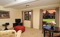 a living room filled with furniture and a flat screen tv