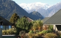 a house with a mountain in the background